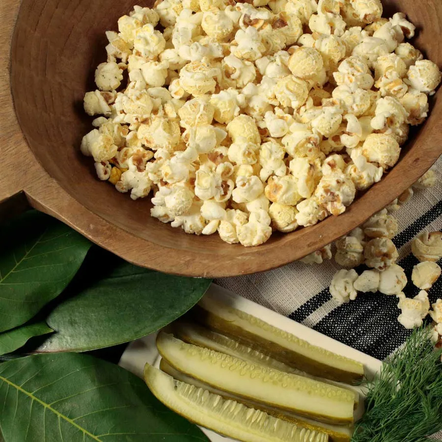 A bowl of Nibblers dill pickle popcorn
